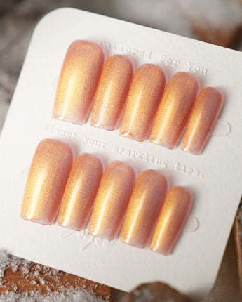 Aurora Flame press-on nails in medium square shape — orange & gold cat eye