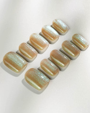 Aurora Mist press-on nails in medium square shape — Champagne Nude, Green Aurora Cat Eye.