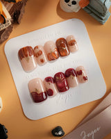 Autumn Bounty press-on nails with orange pumpkin, red apple and glossy fall details
