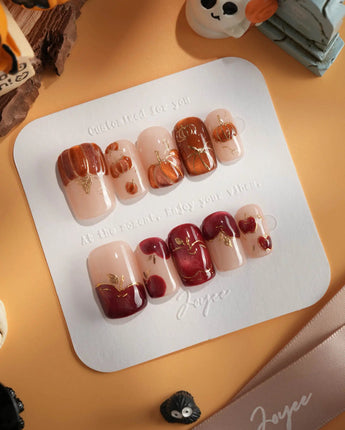 Autumn Bounty press-on nails with orange pumpkin, red apple and glossy fall details