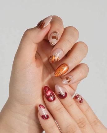 Autumn Bounty press-on nails with harvest pumpkin, apple and glossy nude gel details