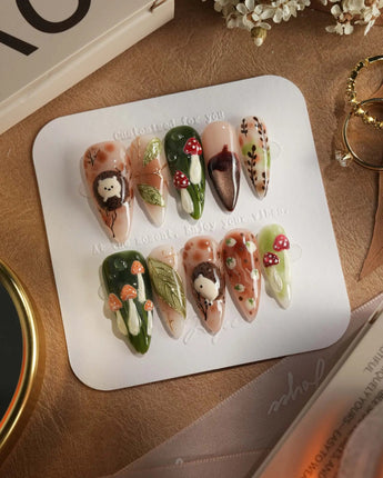 Autumn Tales press-on nails with forest mushroom accents, fall colors and glossy 3D details