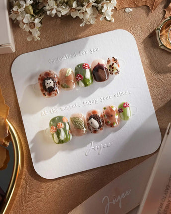 Autumn Tales press-on nails with woodland hedgehog art, mushrooms and autumn gel accents