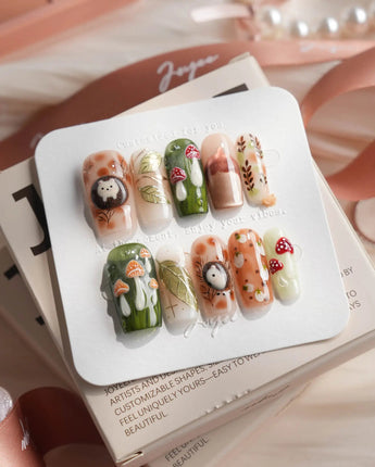 Autumn Tales medium square press-on nails with hedgehog, mushroom, and autumn forest details