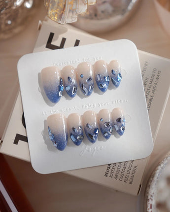 Azure Dream nails in short almond — Glacial Blue & Nude