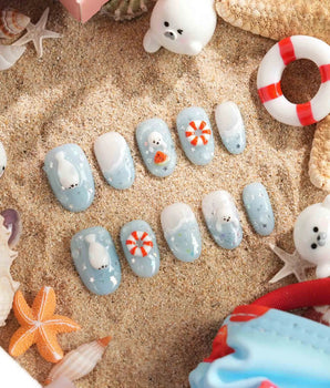Baby Seals handmade press-on nails featuring Light Blue Ocean Style, 3D Cute Seals & Lifebuoys.