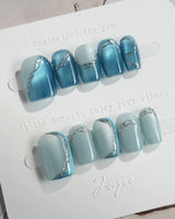 Banff Blue press-on nails in extra short square shape — Cat Eye Blue Nails with Chrome Outline