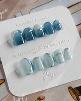 Banff Blue press-on nails in extra short squoval shape — Cat Eye Blue Nails with Chrome Outline