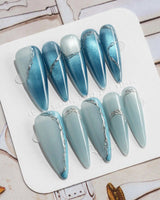 Banff Blue press-on nails in long stiletto shape — Cat Eye Blue Nails with Chrome Outline