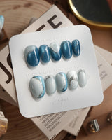 Banff Blue press-on nails in short oval shape — Cat Eye Blue Nails with Chrome Outline