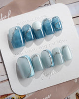 Banff Blue press-on nails in short square shape — Cat Eye Blue Nails with Chrome Outline