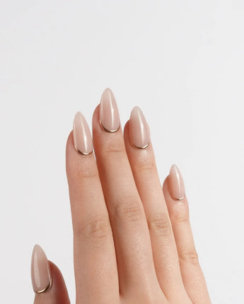 Bare Skin nail art close-up showing Minimalist Nude Chic, Champagne Gold Cuticle Outlines. details