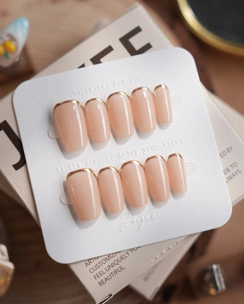 Bare Skin press-on nails in short coffin shape — Minimalist Nude Chic, Champagne Gold Cuticle Outlines.