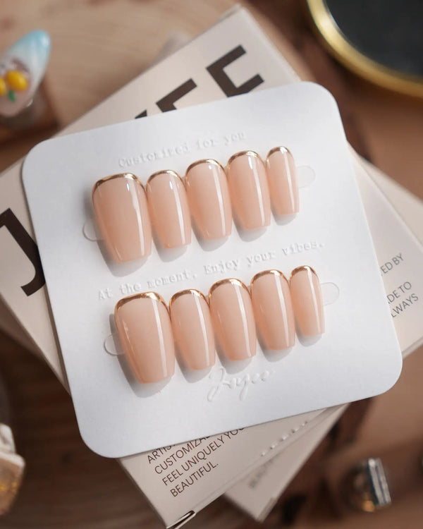 Bare Skin press-on nails in short coffin shape — Minimalist Nude Chic, Champagne Gold Cuticle Outlines.