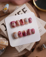 Baroque Palette extra short coffin press-on nails with marble swirls and gold outlines