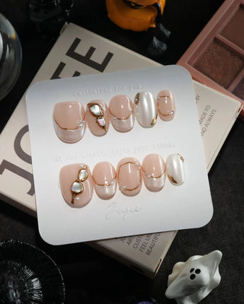 Baroque Pearl handmade press-on nails in extra short oval shape by Joyee Nails