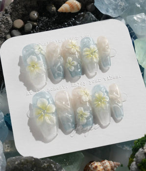 Bora Bora Blue island nails with ocean shimmer, sculpted plumeria, and wave texture
