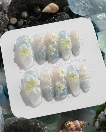 Bora Bora Blue island nails with ocean shimmer, sculpted plumeria, and wave texture