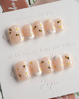 Beebee Nail Art press-on nails in extra short squoval shape — Warm French, Daisy & Honeybee.