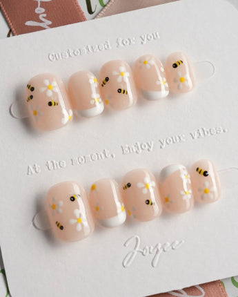 Beebee Nail Art press-on nails in extra short squoval shape — Warm French, Daisy & Honeybee.