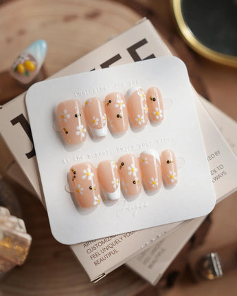 Beebee Nail Art press-on nails in short coffin shape — Warm French, Daisy & Honeybee.