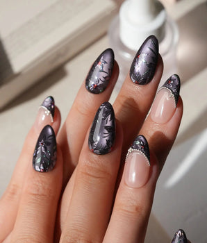 Belladonna press on nails with hand-painted dark lilies in silver outline on violet grey cat eye and nude nails edged in silver beads - image 2
