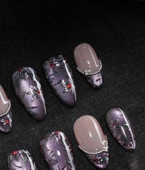 Belladonna press on nails with hand-painted dark lilies in silver outline on violet grey cat eye and nude nails edged in silver beads - image 1