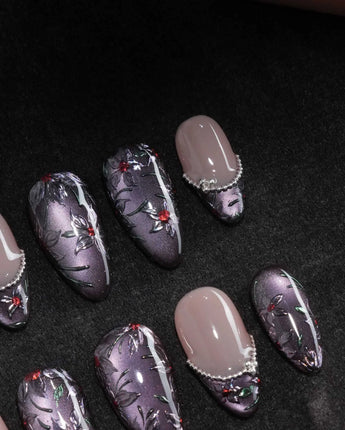 Belladonna press on nails with hand-painted dark lilies in silver outline on violet grey cat eye and nude nails edged in silver beads - image 1