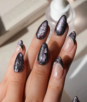 Belladonna press on nails with hand-painted dark lilies in silver outline on violet grey cat eye and nude nails edged in silver beads - image 2