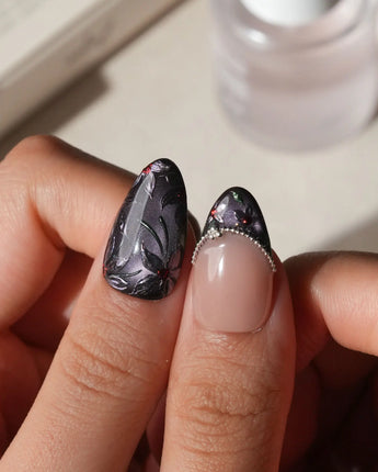 Belladonna press on nails with hand-painted dark lilies in silver outline on violet grey cat eye and nude nails edged in silver beads - image 4