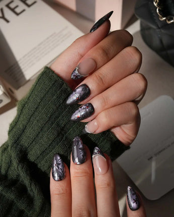 Belladonna press on nails with hand-painted dark lilies in silver outline on violet grey cat eye and nude nails edged in silver beads - image 5