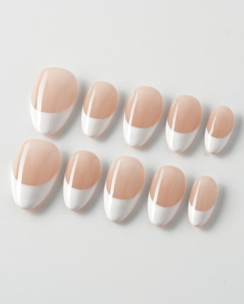 Belle Époque press-on nails in extra short almond shape — classic French tip nails