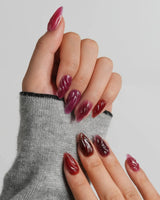 Berry Jelly short almond nails with carved wave texture and glossy berry jelly finish