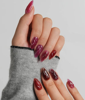Berry Jelly short almond nails with carved wave texture and glossy berry jelly finish