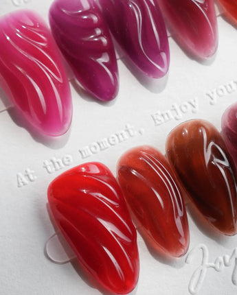 Berry Jelly short almond press-ons with translucent jelly gloss and hand-carved texture