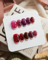 Berry Jelly extra short oval nails with translucent berry tones and wave-carved gel texture