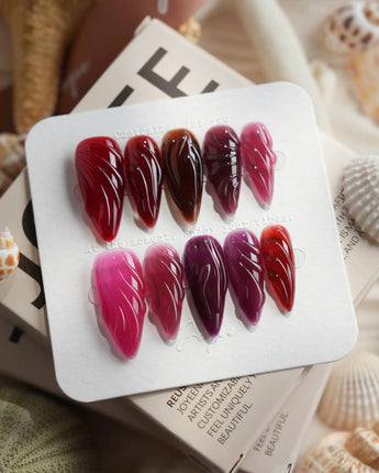 Berry Jelly medium stiletto nails with deep berry gradient and glossy sculpted finish