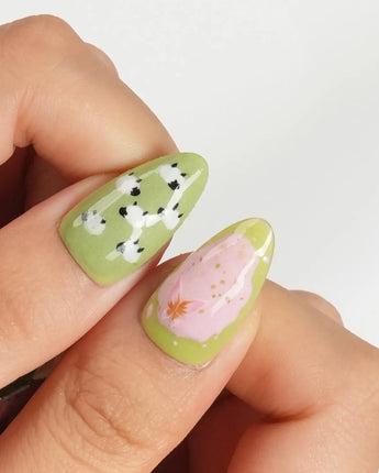 Berry Matcha glossy summer nails with matcha green, strawberry pink, and daisy details