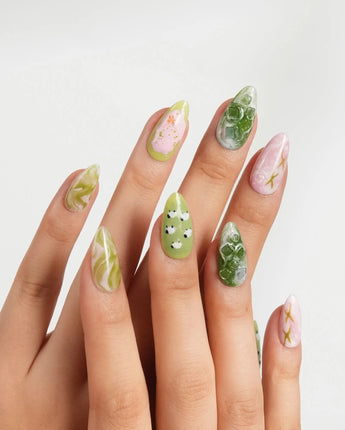 Berry Matcha iced drink press-on nails with daisies, flower accents, and gold flecks