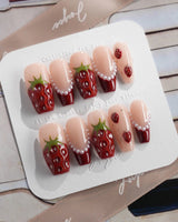 Berry me strawberry season press-on nails with glossy red fruit and nude gel