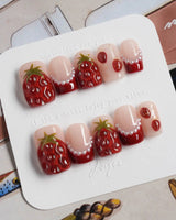Berry me hand-sculpted strawberry nails with glossy cherry red and pearl accents