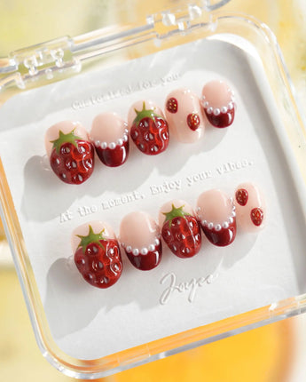 Berry me summer press-on nails with strawberry charms and soft nude polish
