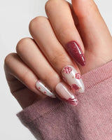 Berry Tart close-up of sculpted raspberry nail details and metallic rose-gold accents