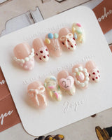 Birthday Party press-on nails in extra short almond shape — Dreamy Candy Style, 3D Bows & Strawberry Cream Cake.