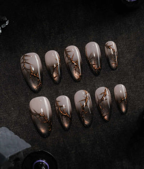 Black Briar press on nails with a nude to black cat eye ombre and raised gold thorn branches - image 2