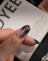 Black Briar handmade press-on nails in medium oval shape by Joyee Nails