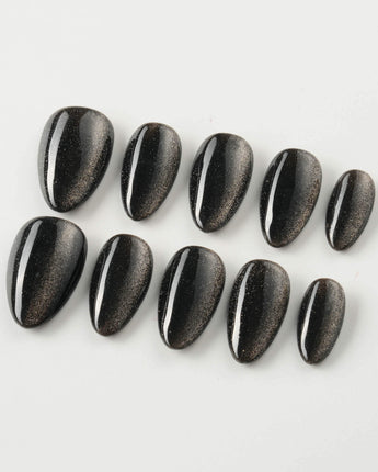 Black Cat-eye press-on nails in extra short almond shape — black cat eye