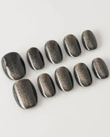 Black Cat-eye press-on nails in extra short oval shape — black cat eye