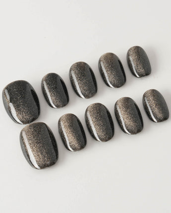 Black Cat-eye press-on nails in extra short oval shape — black cat eye
