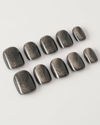 Black Cat-eye press-on nails in extra short squoval shape — black cat eye